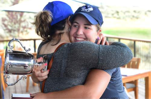 Scott Sommerdorf   |  The Salt Lake Tribune  
Kendra Dalton gets a hug from her mother, Liane Dalton, after winning the 2016 Utah Women's State Amateur golf tournament over Lea Garner - both of BYU - at Victory Ranch Golf Club in Francis, Friday, August 5, 2016.