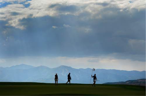 Scott Sommerdorf   |  The Salt Lake Tribune  
Kendra Dalton, Lea Garner and a coach on the 17th green during a gentle rain at the 2016 Utah Women's State Amateur golf tournament at Victory Ranch Golf Club in Francis, Friday, August 5, 2016. Dalton won the match over her BYU team mate Garner.