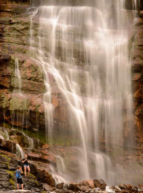 Trent Nelson  |  The Salt Lake Tribune
Hikers cool off at Bridal Veil Falls in Provo, Friday August 5, 2016.