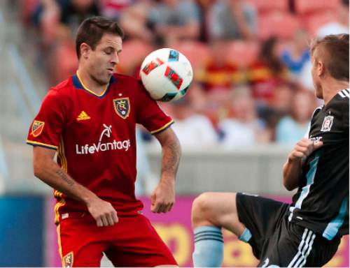 Michael Mangum  |  Special to the Tribune

Real Salt Lake forward Juan Manuel Martinez (7) hits the ball with his shoulder in front of Chicago Fire midfielder Michael Stephens (26) during their MLS match at Rio Tinto Stadium in Sandy, Utah on Saturday, August 6th, 2016.