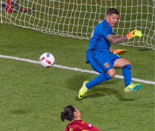 Michael Mangum  |  Special to the Tribune

Real Salt Lake goalkeeper Nick Rimando (18) makes the second of a late-game double save with defender Tony Beltran (2) sliding by during their MLS match against the Chicago Fire at Rio Tinto Stadium in Sandy, Utah on Saturday, August 6th, 2016.