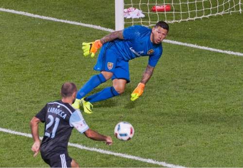 Michael Mangum  |  Special to the Tribune

Real Salt Lake goalkeeper Nick Rimando (18) scrambles up from late-game save with an onrushing Chicago Fire midfielder Nick LaBrocca (21) during their MLS match against the Chicago Fire at Rio Tinto Stadium in Sandy, Utah on Saturday, August 6th, 2016.