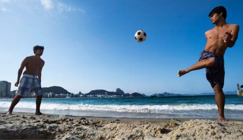 Rick Egan  |  The Salt Lake Tribune

A couple of local kids kick the ball around on Copacabana beach, in Rio de Janeiro, Thursday, August 4, 2016.