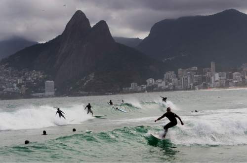Rick Egan  |  The Salt Lake Tribune

The Dois Irmãnos, or Two Brothers in english,  loom in the back ground as Surfers ride the waves at Ipanema  in Rio de Janeiro, Thursday, August 4, 2016.