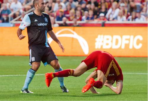 Michael Mangum  |  Special to the Tribune

Real Salt Lake forward Juan Manuel Martinez (7) is brought down with a foul in the box by Chicago Fire defender Eric Gehrig (6) while midfielder Nick LaBrocca (21) looks on during their MLS match at Rio Tinto Stadium in Sandy, Utah on Saturday, August 6th, 2016.