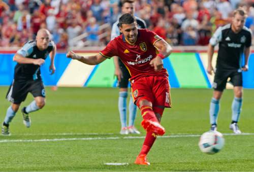 Michael Mangum  |  Special to the Tribune

Real Salt Lake midfielder Javier Morales (11) takes a penalty kick as Chicago Fire players rush in during their MLS match at Rio Tinto Stadium in Sandy, Utah on Saturday, August 6th, 2016. Morales scored on the kick and Real Salt Lake led 2-0 at the half.