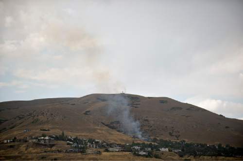 Lennie Mahler  |  The Salt Lake Tribune

A 1-acre grass fire burns near Ensign Peak trailhead in Salt Lake City, Saturday, Aug. 6, 2016