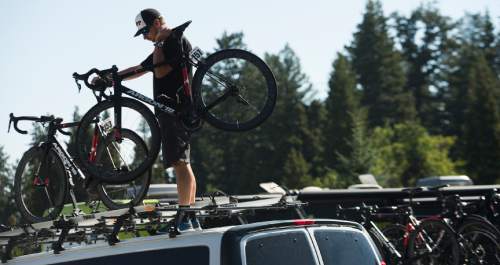 Leah Hogsten  |  The Salt Lake Tribune
Head mechanic for Silber Pro Cycling team Doug Berner hands off bikes at the start of Stage 6 of the Tour of Utah on Saturday, August 6, 2016 that took cyclists on a 114-mile ride with over 11,000 feet of climbing from Snowbasin Ski Resort to Snowbird.