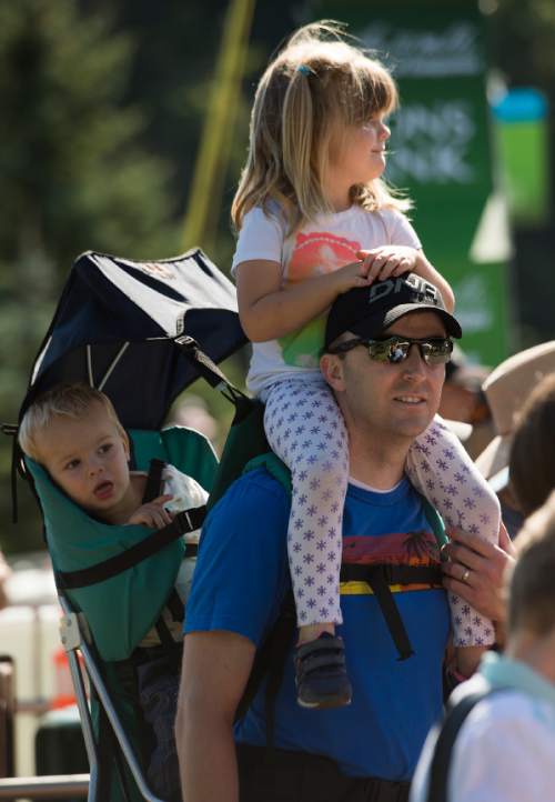 Leah Hogsten  |  The Salt Lake Tribune
Josh Chandler and his children June, 4, and Oliver, 1, of Sandy cheer on Jelly Belly riders at the start of Stage 6 of the Tour of Utah on Saturday, August 6, 2016 that took cyclists on a 114-mile ride with over 11,000 feet of climbing from Snowbasin Ski Resort to Snowbird.