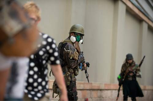 Lennie Mahler  |  The Salt Lake Tribune

Counter-zombie forces direct zombies along the street in the 9th annual SLC Zombie Walk in downtown Salt Lake City, Sunday, Aug. 7, 2016.