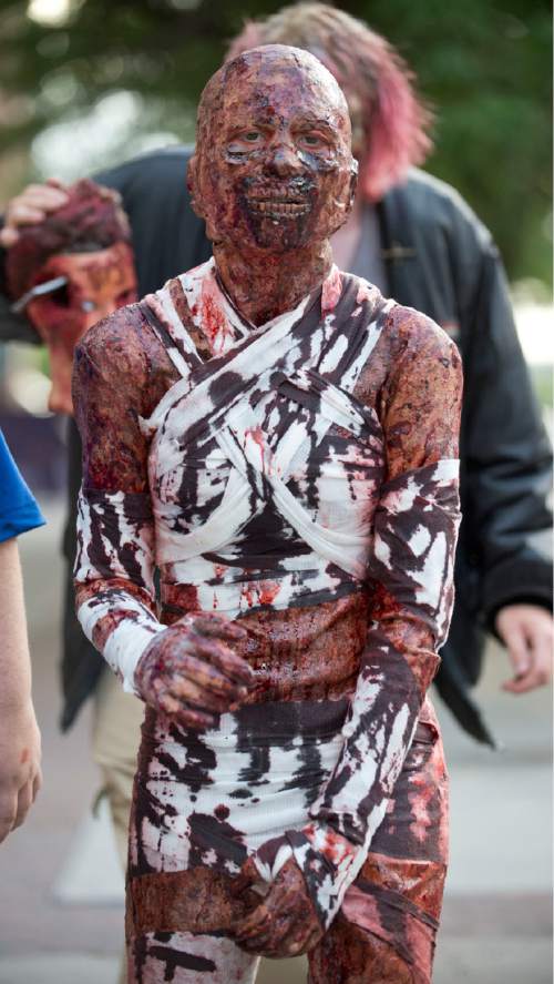 Lennie Mahler  |  The Salt Lake Tribune

Zombies take to the streets in the 9th annual SLC Zombie Walk in downtown Salt Lake City, Sunday, Aug. 7, 2016.