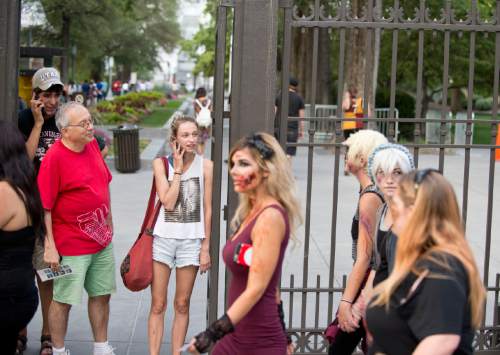 Lennie Mahler  |  The Salt Lake Tribune

People watch as zombies take to the streets in the 9th annual SLC Zombie Walk in downtown Salt Lake City, Sunday, Aug. 7, 2016.