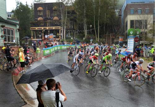 Scott Sommerdorf   |  The Salt Lake Tribune  
Riders turn off Park City's Main Street under a sudden downpour as the final stage of the Tour of Utah starts, Sunday, August 7, 2016.