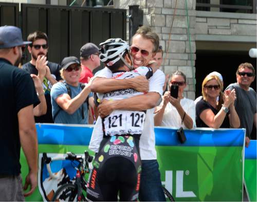 Scott Sommerdorf   |  The Salt Lake Tribune  
Lachlan Morton of Jelly Belly Racing & pb Maxxis gets a hug from his support team at the finish line after winning the Tour of Utah, Sunday, August 7, 2016.