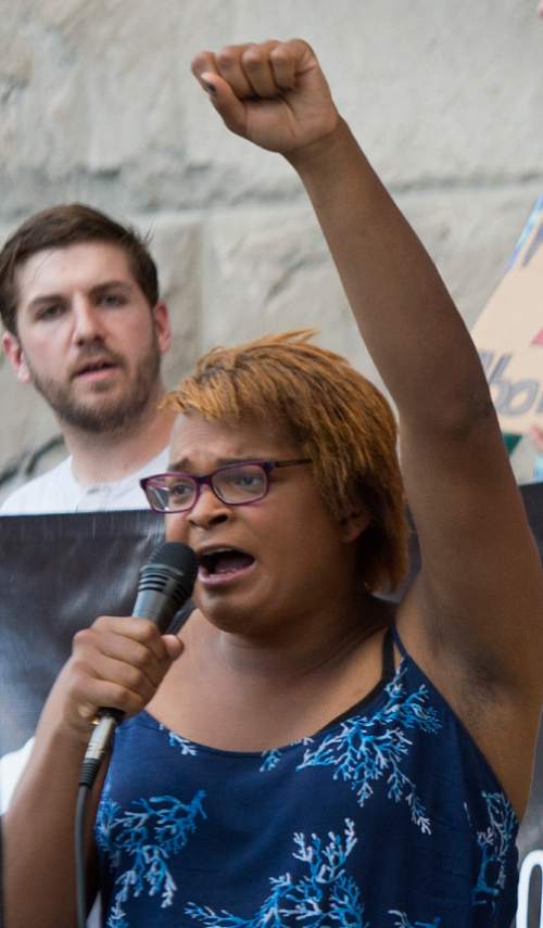 Leah Hogsten  |  The Salt Lake Tribune
Hayven Jackson with Utah Against Police Brutality speaks during an "emergency rally" at the Salt Lake City and County Building, Tuesday, August 9, 2016, to protest Salt Lake County District Attorney Sim Gill's announcement that two police officers who shot and critically wounded a 17-year-old in February will not face criminal charges and were justified in that shooting. Abdullahi "Abdi" Mohamed, a Somali refugee, survived the shooting and remains in a wheelchair. Protesters are calling for the resignation of Gill, as well as Salt Lake City Mayor Jackie Biskupski.