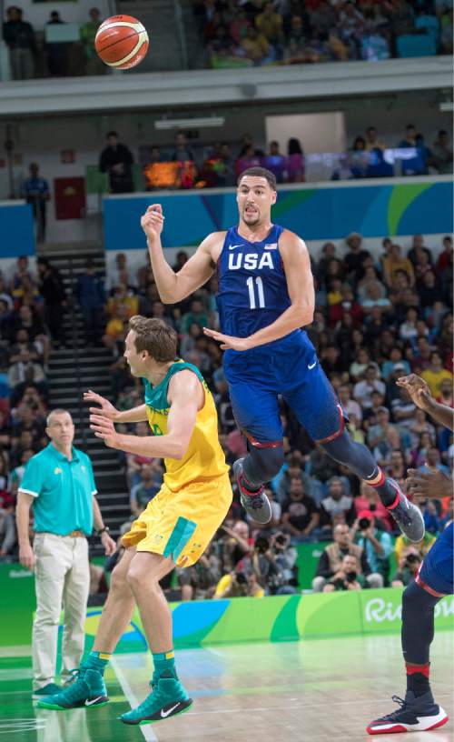 Rick Egan  |  The Salt Lake Tribune

Klay Thompson (11) of United States leaps in the air to save the ball from going out of bounds, with out landing on Ryan Broekhoff (9) of Australia, in Olympic basketball action, USA vs. Australia, in Rio de Janeiro, Wednesday, August 10, 2016.
