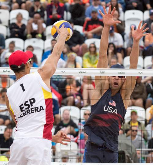 Rick Egan  |  The Salt Lake Tribune

Pablo Herrera Allepuz (1) of Spain, hits the ball past Jake Gibb, USA, in beach volleyball action, USA vs. Spain, at the Beach Volleyball Arena, in Rio de Janeiro, Wednesday, August 10, 2016.