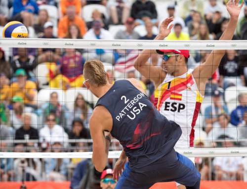 Rick Egan  |  The Salt Lake Tribune

Casey Patterson (2) hits the ball past Pablo Herrera Allepuz (1) of Spain, in beach volleyball action, USA vs. Spain, at the Beach Volleyball Arena, in Rio de Janeiro, Wednesday, August 10, 2016.