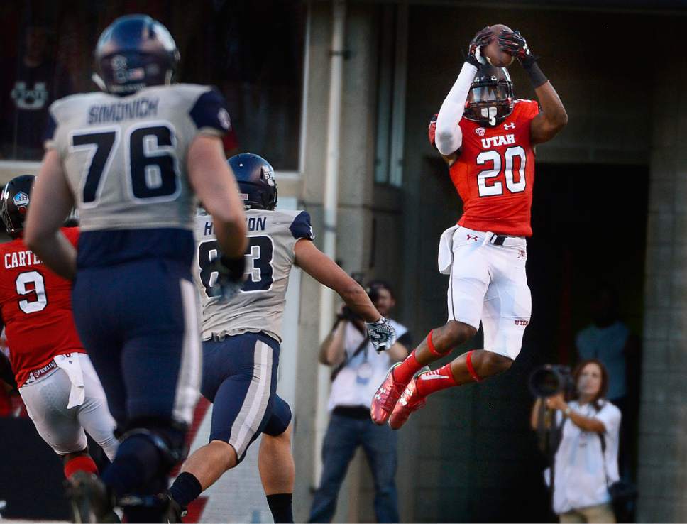 Scott Sommerdorf   |  The Salt Lake Tribune
Utah Utes defensive back Marcus Williams (20) goes up high to intercept a pass during first half play after USU QB Chuckie Keeton was flushed out of the pocket and threw across the field. Utah and Utah State were tied 14-14 at the half at Rice-Eccles, Friday, September 11, 2015.