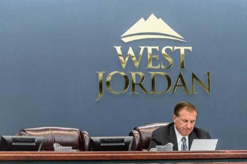 Trent Nelson  |  The Salt Lake Tribune
West Jordan Mayor Kim Rolfe reads a statement regarding Councilman Jeff Haaga's recent citation during a council meeting, Wednesday August 10, 2016. Haaga was not present at the meeting, and his empty chair is at left. Haaga was recorded July 19 on police body camera video in which he appeared to be drunk. Officers cited him for hit-and-run after witnesses said he drove away from a local bar after hitting a car in the parking lot earlier that evening.