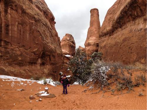 Erin Alberty  |  The Salt Lake Tribune

The author's daughter explores the rock formations near the Devils Garden campground, the trailhead for the Broken Arch loop hike, on Nov. 29, 2015 at Arches National Park.