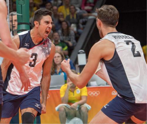 Rick Egan  |  The Salt Lake Tribune

Taylor Sander (3) celebrates with Aaron Russell (2) of United States after a big point in game 4, in volleyball action USA vs. Brazil, in Rio de Janeiro, Thursday, August 11, 2016.