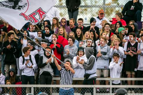 Chris Detrick  |  The Salt Lake Tribune
Alta students cheer after a touchdown during the game at Kearns High School Friday October 30, 2015.