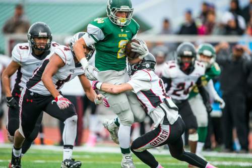 Chris Detrick  |  The Salt Lake Tribune
Kearns' Graden Luckart (2) is tackled by Alta's MJ Tafisi (4) 
and Alta's London Rockwood (10) during the game at Kearns High School Friday October 30, 2015.