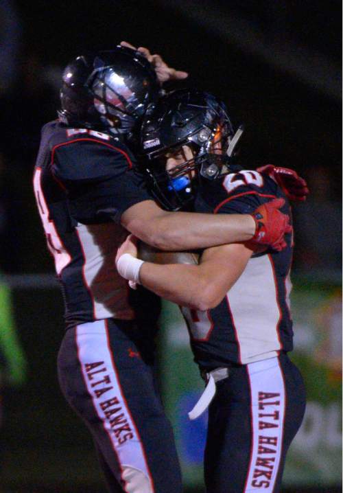 Leah Hogsten  |  The Salt Lake Tribune
Alta's Josh Davis scampers around the edge for 73-yard touchdown. 
Alta High School football team leads Corner Canyon High School 31-24, Friday, October 23, 2015 at Alta.