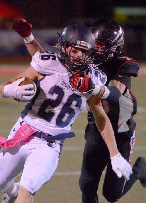 Leah Hogsten  |  The Salt Lake Tribune
Corner Canyon's Jason Adams is brought down by Alta's Trai Hunkin. 
Alta High School football team leads Corner Canyon High School 31-24, Friday, October 23, 2015 at Alta.