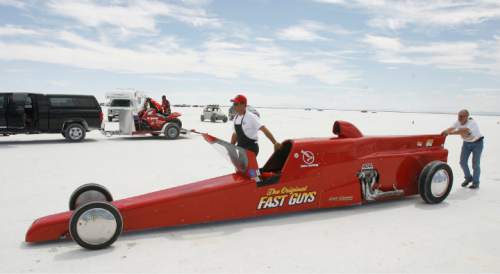 Rick Egan   |  Tribune file photo

Calvin Dirks (left) and Cameron Shadle push "The Original Fast Guys" car to the starting line as driver Ed Shadle takes a run during Speed Week at the Bonneville Salt Flats, Thursday, August 18, 2011.