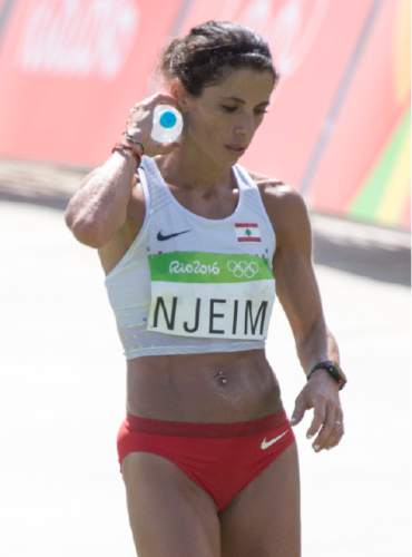 Rick Egan  |  The Salt Lake Tribune

Chirine Njeim, Lebanon, cools down as after crossing the finish line in the Sambódromo, in the Women's Marathon, in Rio de Janeiro Brazil, Sunday, August 14, 2016.
