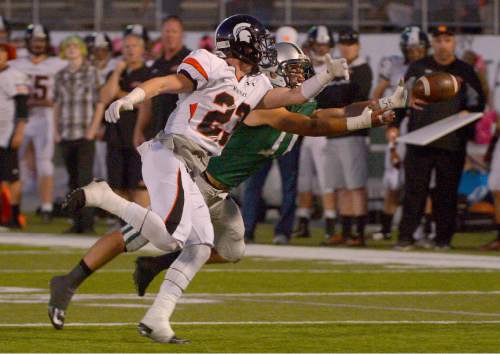 Leah Hogsten  |  The Salt Lake Tribune
A pass intended for Olympus' Nate Hoole is just out of reach with Murray's Taylor Litson on defense. Olympus High School leads Murray High School, 30-7 during their football game Friday, October 9, 2015 at Olympus High School.