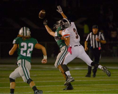 Leah Hogsten  |  The Salt Lake Tribune
Olympus' Britton Hoggan can't make the catch with Murray's Jensen Kay on defense. Olympus High School leads Murray High School, 30-7 during their football game Friday, October 9, 2015 at Olympus High School.