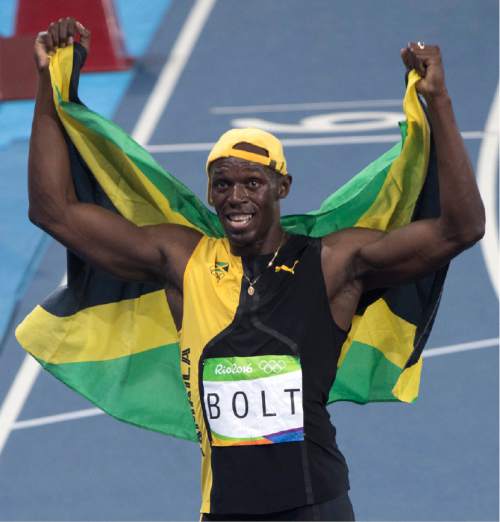 Rick Egan  |  The Salt Lake Tribune

Usain Bolt makes history in Rio with his third successive Olympic 100m gold medal as he wins the mens 100m at The Olympic Stadium in Rio de Janeiro, Sunday, August 14, 2016.