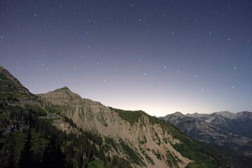Lennie Mahler  |  The Salt Lake Tribune

Light spills in from Utah Valley as the night sky shines over Timpooneke Trail on Mount Timpanogos in the early hours Sunday, July 24, 2016.