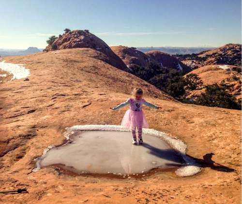 Erin Alberty  |  The Salt Lake Tribune

The author's daughter catches her balance on an icy pothole Dec. 2, 2015 on Whale Rock in Canyonlands National Park.