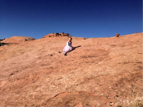 Erin Alberty  |  The Salt Lake Tribune

The author's daughter rests in the middle of a climb Dec. 2, 2015 on Whale Rock in Canyonlands National Park.