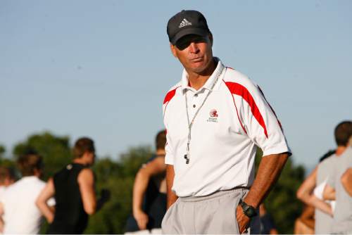 Head coach Larry Wall gives orders during Bountiful High football practice early Friday, July 17,  2009.Rick Egan/The Salt Lake Tribune