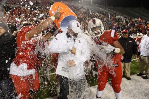 Scott Sommerdorf   |  The Salt Lake Tribune
East players douse head coach Brandon Matich as East beat Timpview 49-14 for the Utah 4A championship, Friday, November 20, 2015.