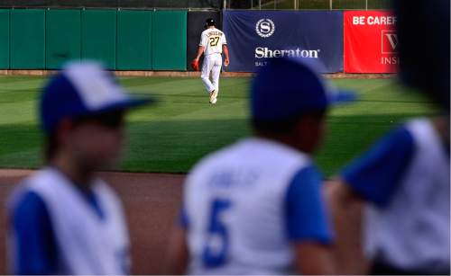 Scott Sommerdorf   |  The Salt Lake Tribune  
As little league players lined up for pre-game ceremonies, former San Francisco Giants and Los Angeles Angels pitcher Tim Lincecum warms up in center field prior to making his first start in Salt Lake for the Salt Lake Bees, Monday, August 15, 2016.