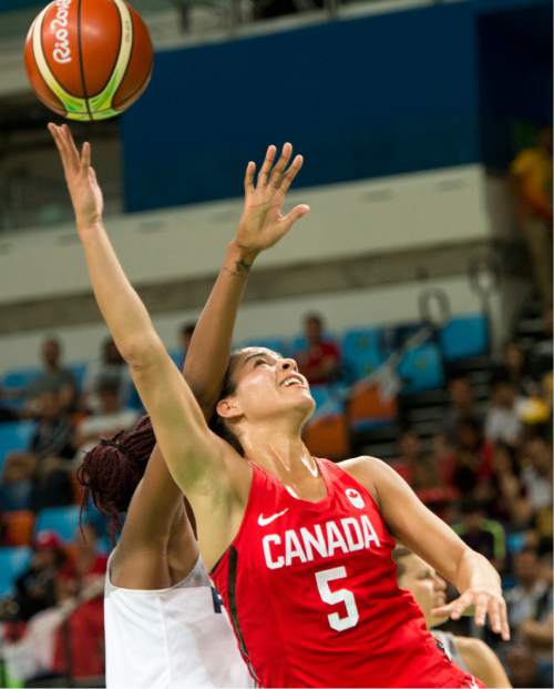 Rick Egan  |  The Salt Lake Tribune

Kia Nurse (5) of Canada shoots as Valeriane Ayayi (11) defends for France, in Olympic Women's basketball action in Rio de janeiro, Tuesday, August 16, 2016.