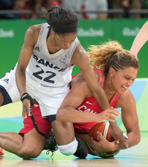 Rick Egan  |  The Salt Lake Tribune

Miah-Marie Langlois (4) grabs a loose ball from Olivia Epoupa (22) of France, in Olympic Women's basketball action in Rio de janeiro, Tuesday, August 16, 2016.
