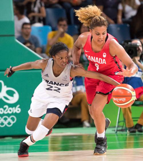 Rick Egan  |  The Salt Lake Tribune

Miah-Marie Langlois (4) of Canada tips the ball from Olivia Epoupa (22) of France, in Olympic Women's basketball action in Rio de janeiro, Tuesday, August 16, 2016.