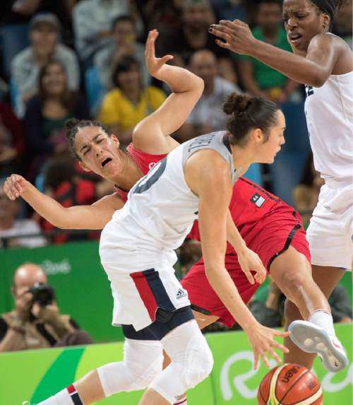Rick Egan  |  The Salt Lake Tribune

Kia Nurse (5) of Canada collides with Sarah Michel (10) of France. in Olympic Women's basketball action in Rio de janeiro, Tuesday, August 16, 2016.