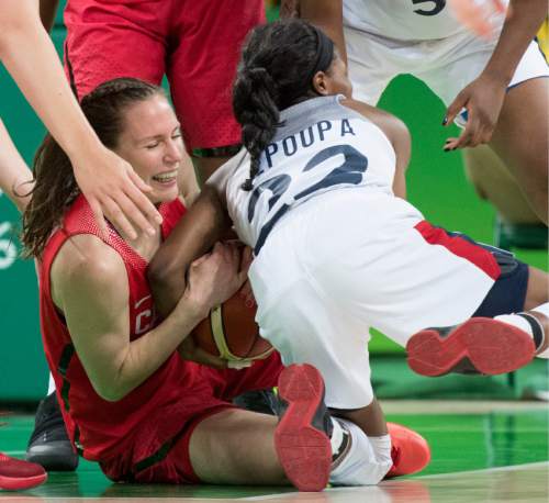 Rick Egan  |  The Salt Lake Tribune

Kim Gaucher (8) of Canada goes for the ball along with Olivia Epoupa (22) of France, in Olympic Women's basketball action in Rio de janeiro, Tuesday, August 16, 2016.