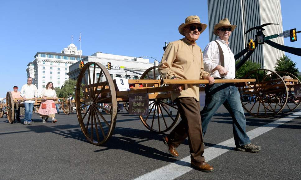 Al Hartmann  |  The Salt Lake Tribune 
Handcart pioneers are among the first off the starting line to start the Tthe Day's of 47 parade in downtown Salt Lake City Monday July 25 celebrating Utah's heritage and spirit.