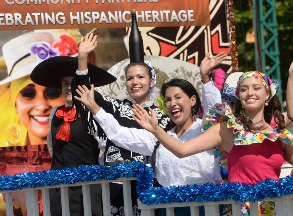 Al Hartmann  |  The Salt Lake Tribune 
Happy faces on Univision's float celebrating hispanic heritage the Day's of 47 parade in downtown Salt Lake City Monday July 25 celebrating Utah's heritage and spirit.