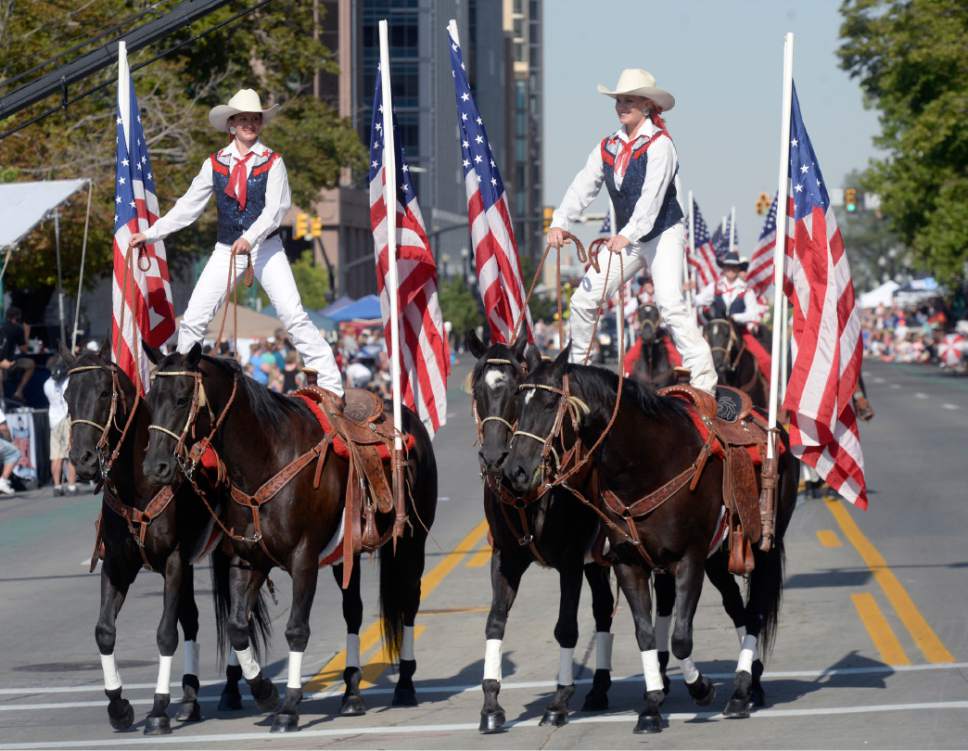 Al Hartmann  |  The Salt Lake Tribune 
Members of Americana's ride horses surrounded by flags in the Day's of 47 parade in downtown Salt Lake City Monday July 25 celebrating Utah's heritage and spirit.