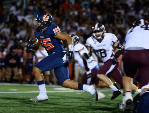 Scott Sommerdorf   |  The Salt Lake Tribune
Brighton RB Sione Lund breaks away for a 76 yard TD scamper on a 4th and 1 play during first half play. Jordan led Brighton 34-21 at the half at Brighton Friday, September 25, 2015.